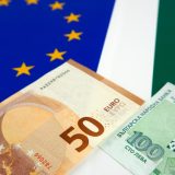 Bulgarian and European Union banknotes in front of EU and Bulgarian flag
